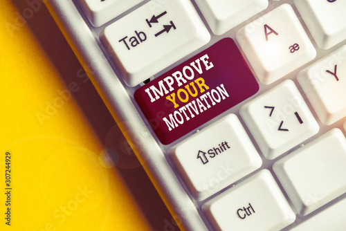 Writing note showing Improve Your Motivation. Business concept for Boost your self drive Enhance Motives and Goals White pc keyboard with note paper above the white background photo
