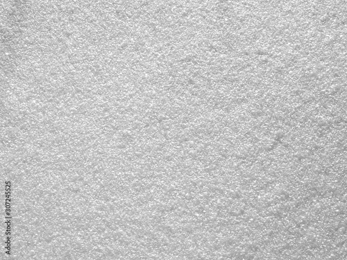 Smooth surface of snow close up. White pattern. Background