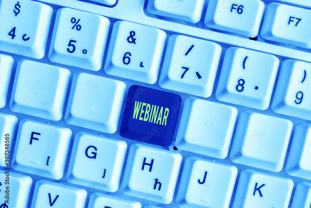 Word writing text Webinar. Business photo showcasing defined as seminar conducted over the Internet Web conferencing White pc keyboard with empty note paper above white background key copy space Word writing text Webinar. Business photo showcasing defined as seminar conducted over the Internet Web conferencing White pc keyboard with empty note paper above white background key copy space