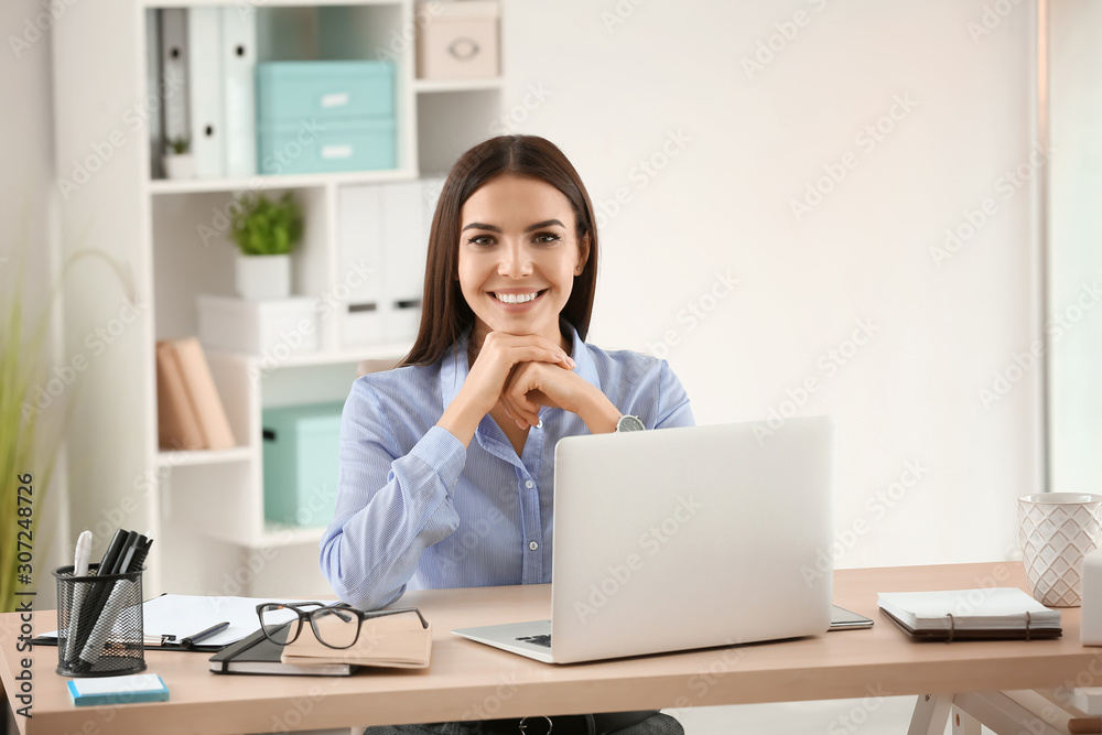 Beautiful young businesswoman working in office Beautiful young businesswoman working in office
