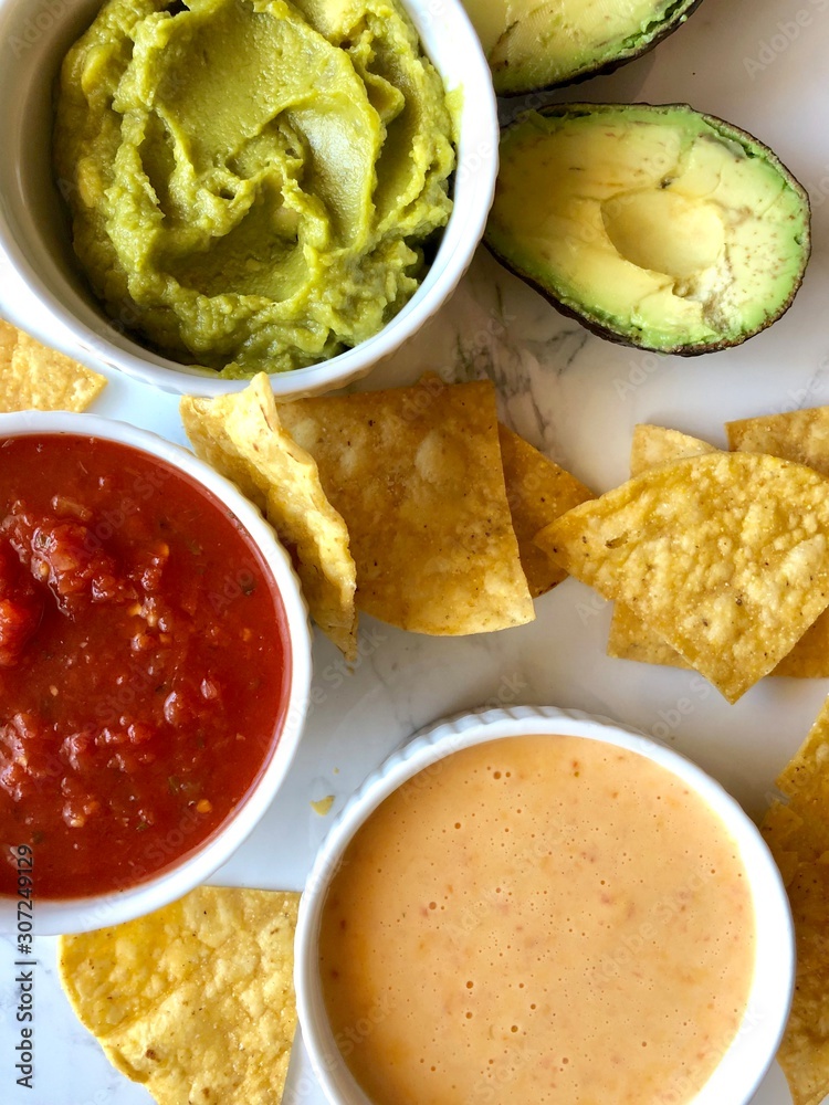 chips and salsa, guac and queso Stock Photo Adobe Stock