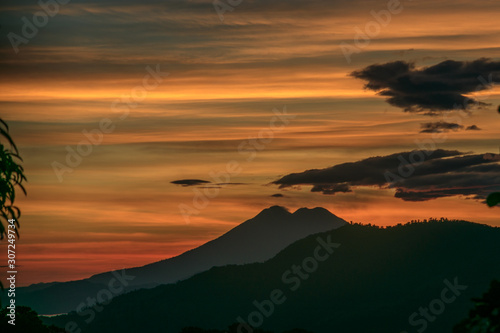 Beautiful and colorful Sunrise in November overlooking at the Volcano of San Vicente y El Salvador, Central America, with such brigh colors