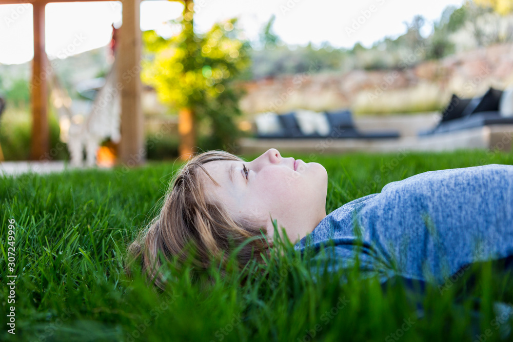 Boy lying on grass