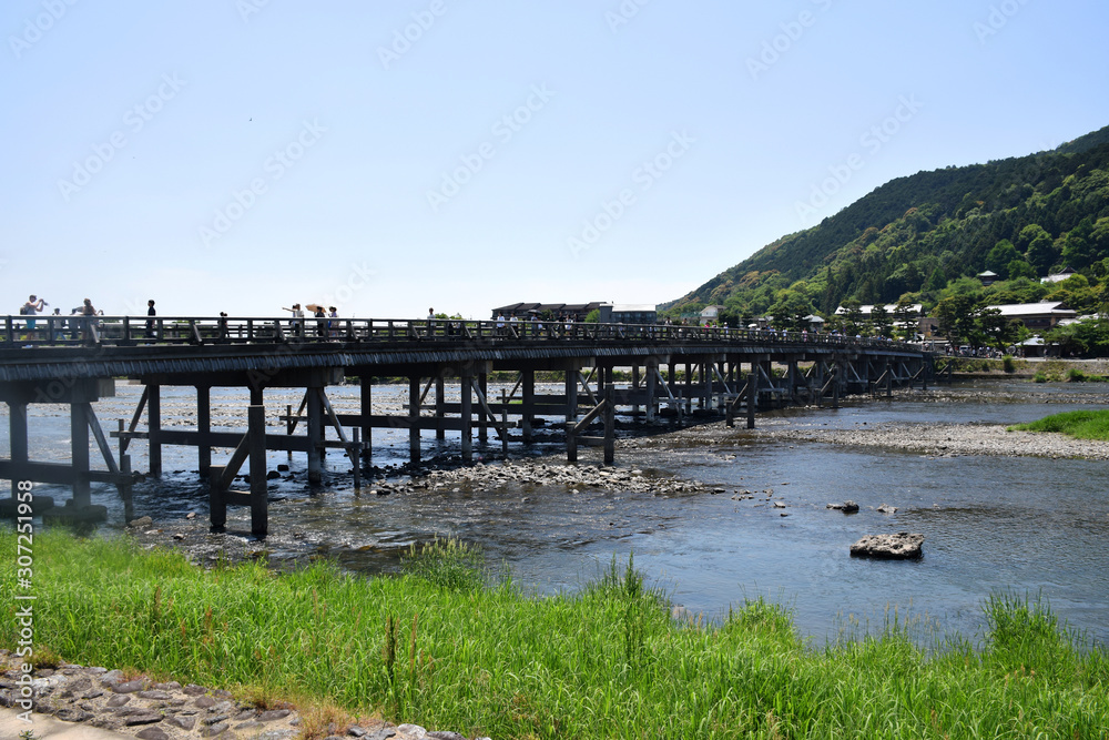Kyoto, Japan - May 22 2017: View of the Togetsu-Kyo Bridge (near the Arashiyama Monky Park Iwatayama) with people crossing