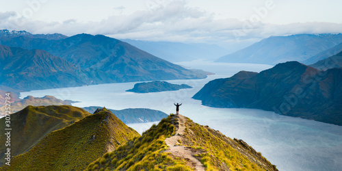 Roys peak mountain hike in Wanaka New Zealand. Popular tourism travel destination. Concept for hiking travel and adventure. New Zealand landscape background. photo