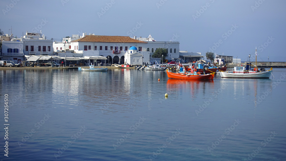 Picturesque port and main village of Mykonos island with traditional fishing boats and beautiful sunny weather, Cyclades, Greece