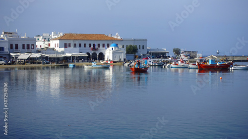 Picturesque port and main village of Mykonos island with traditional fishing boats and beautiful sunny weather, Cyclades, Greece