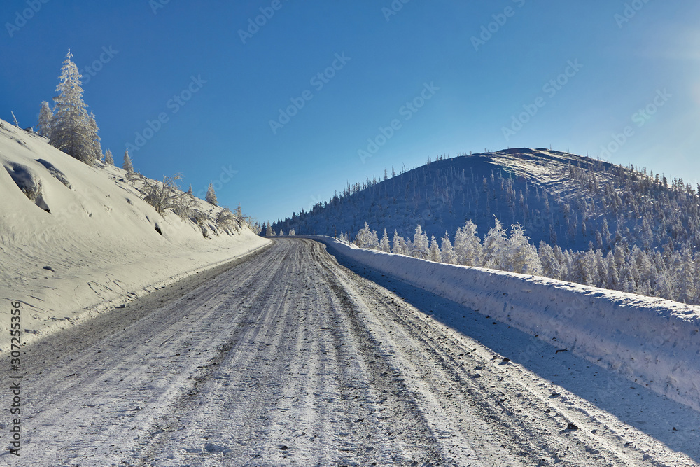 Winter. Mountain road, climb to the pass. The mountains. Snow