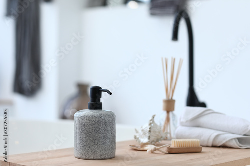 Bath accessories on wooden table
