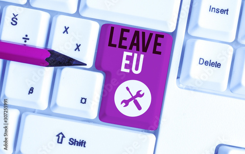 Text sign showing Leave Eu. Business photo showcasing An act of a demonstrating to leave a country that belongs to Europe White pc keyboard with empty note paper above white background key copy space photo