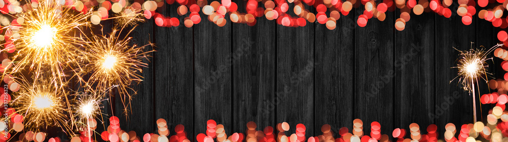 Silvester background banner panorama long- Frame made of sparklers, firework and bokeh lights on rustic wooden texture, with space for text - obrazy, fototapety, plakaty 