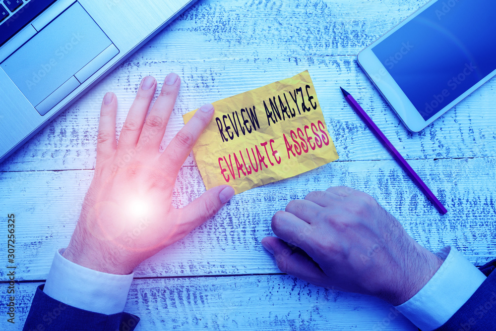 Handwriting text writing Review Analyze Evaluate Assess. Conceptual photo Evaluation of perforanalysisce feedback process Handwriting text writing Review Analyze Evaluate Assess. Conceptual photo Evaluation of perforanalysisce feedback process