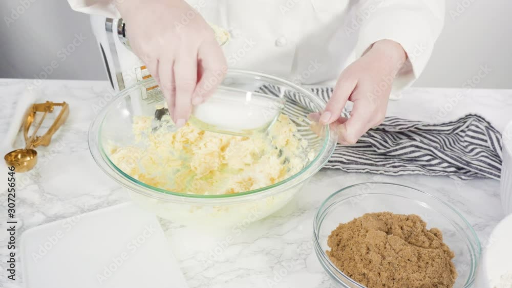 Step by step. Mixing ingredients in a glass bowl to make chocolate chip cookies. Step by step. Mixing ingredients in a glass bowl to make chocolate chip cookies.