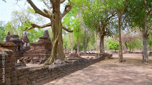 4K video of Chedi Ched Thaeo temple in Si Satchanalai historical park, Thailand. photo