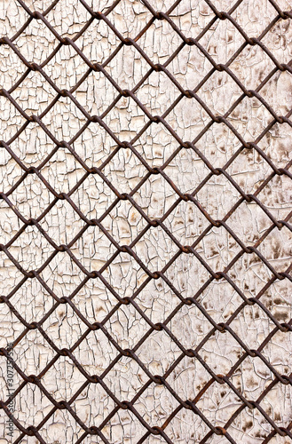 metal grid on cracked wood background