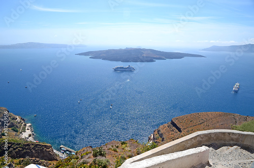 Beautiful panoramic view on Aegean sea with cruise boats and several islands, Santorini, Greece
