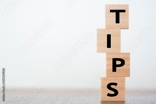 Tips written on wooden cubes photo