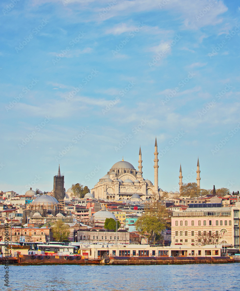 Istanbul cityscape with boats and Suleymaniye Mosque