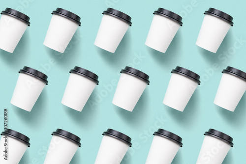 Pattern of paper cups of coffee on a decorative background.