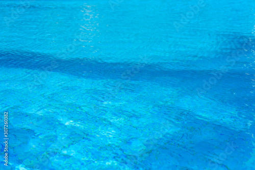 Background of the turquoise water in swimming pool