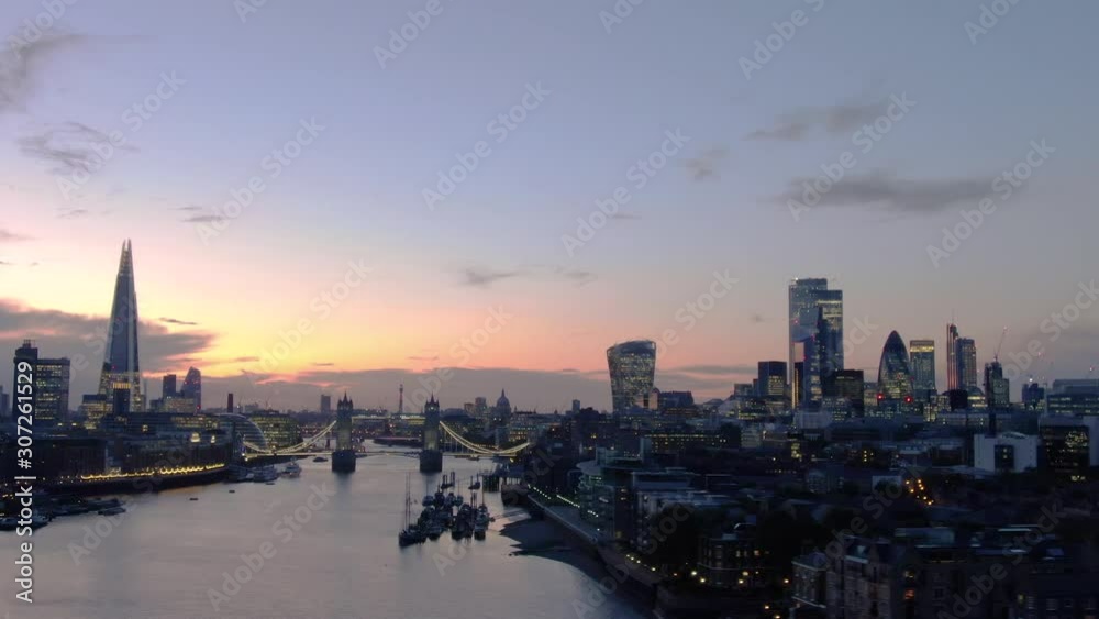 Aerial view of City of London Skyline, The Shard, Tower Bridge and Thames River at dusk in London Aerial view of City of London Skyline, The Shard, Tower Bridge and Thames River at dusk in London