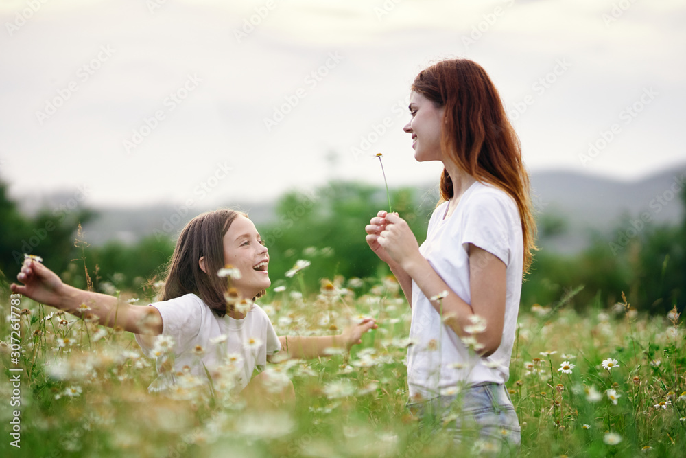 mother and daughter in the field mother and daughter in the field