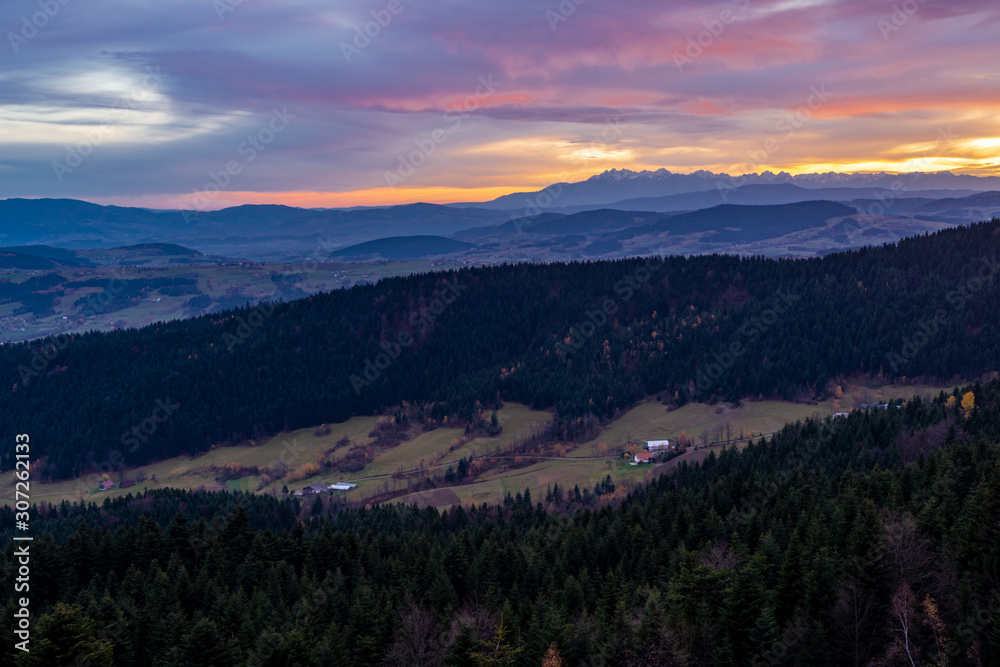 Obraz premium Mountains Tatry in the background at sunset