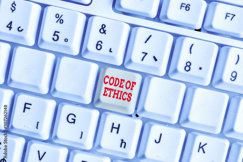 Conceptual hand writing showing Code Of Ethics. Concept meaning basic guide for professional conduct and imposes duties White pc keyboard with note paper above the white background