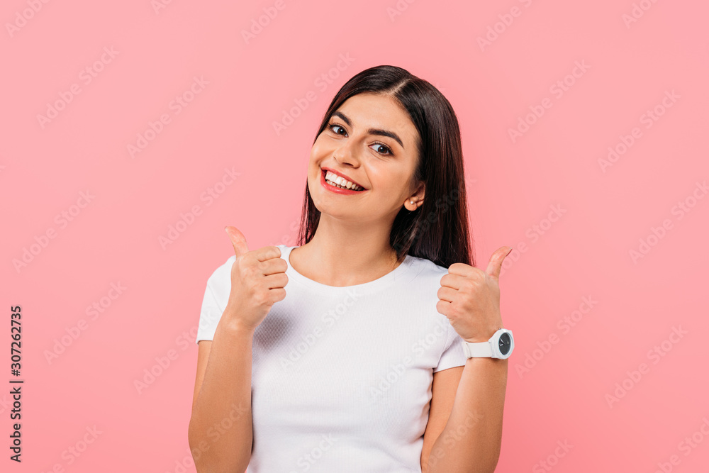 happy pretty brunette girl showing thumbs up isolated on pink happy pretty brunette girl showing thumbs up isolated on pink