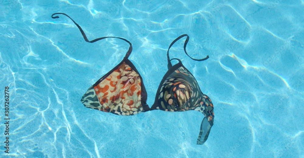 lost bikini top in the pool Stock Photo