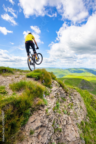 Professional rider is jumping on the bicycle