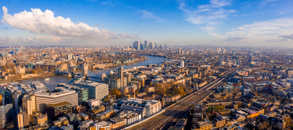 Panoramic aerial view of London, UK. Beautiful skyscrapers, river Thames and railway going through the city. - obrazy, fototapety, plakaty 