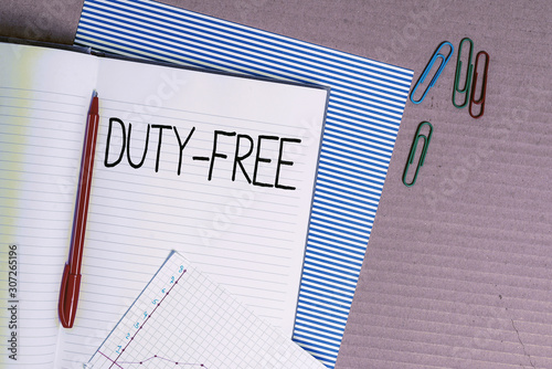 Writing note showing Duty Free. Business concept for Store or establisbhement that sells imported products witout tax Striped paperboard notebook cardboard office study supplies chart paper photo