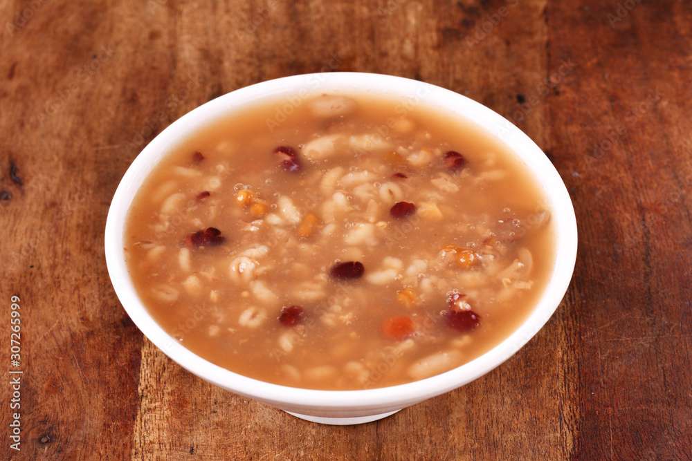 Eight treasure porridge on white wooden table Eight treasure porridge on white wooden table