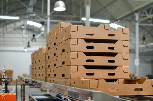 Stack of folded paper box in warehouse