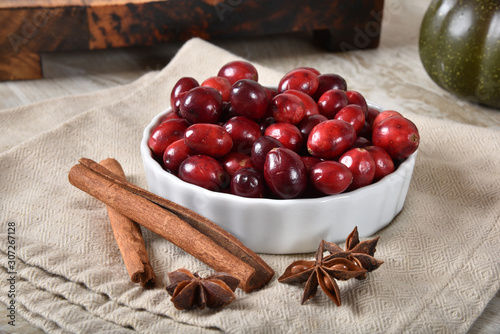 Fototapeta Naklejka Na Ścianę i Meble -  Cranberries and holiday cooking spices