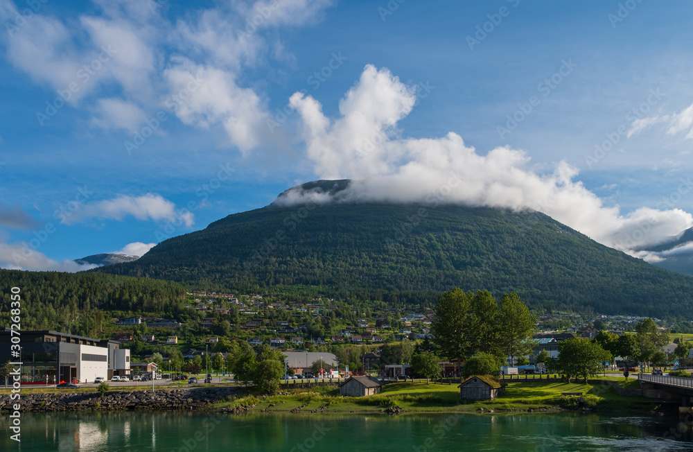 Naklejka premium Sunset over river Stryneelva and Loen village at Stryn, Norway, july 2019.