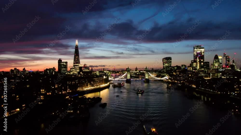 Establishing aerial view of London City Skyline Shard , Thames River and Tower Bridge in foreground, beautiful dusk sky London UK Establishing aerial view of London City Skyline Shard , Thames River and Tower Bridge in foreground, beautiful dusk sky London UK