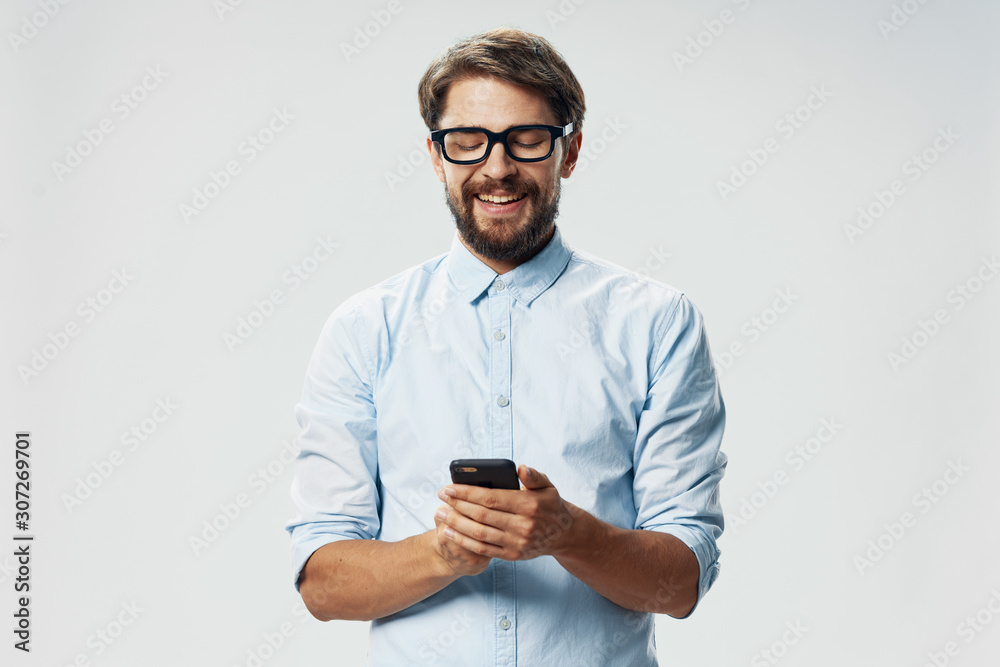 portrait of young man with mobile phone portrait of young man with mobile phone