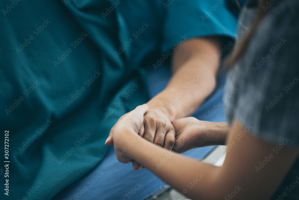 Doctor or nurse holding elderly lady's hands. Doctor or nurse holding elderly lady's hands.