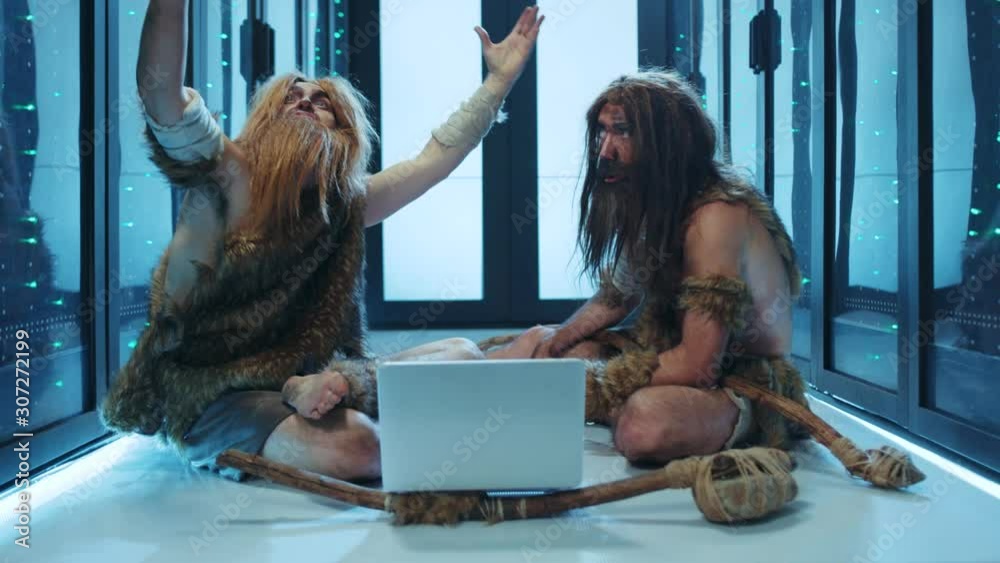 Tribe of prehistoric wild people sitting inside server cabinet ...