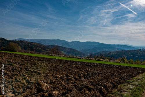 Plowed field overlooking the mountains in autumn