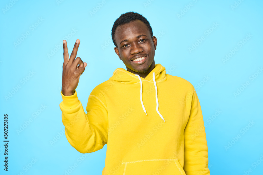 young man showing thumbs up sign young man showing thumbs up sign