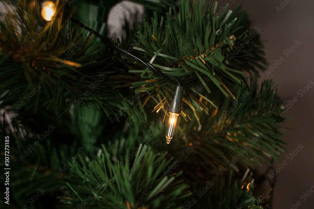 Christmas tree with light decorations . Preparation for Christmas and New Year. Lifestyle. image. Christmas background.Winer holiday. Close up. Detail. Christmas tree with light decorations . Preparation for Christmas and New Year. Lifestyle. image. Christmas background.Winer holiday. Close up. Detail.