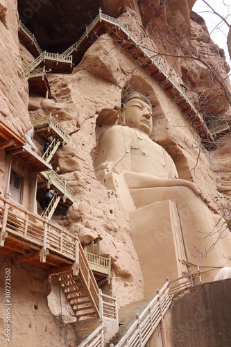 Buddha statue at Bingling Cave Temple in Yongjing, Gansu Province, China.UNESCO World heritage site.(Silk Roads: the Routes Network of Chang'an-Tianshan Corridor) photo