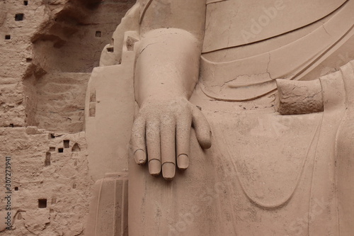 Buddha statue at Bingling Cave Temple in Yongjing, Gansu Province, China.UNESCO World heritage site.(Silk Roads: the Routes Network of Chang'an-Tianshan Corridor) photo