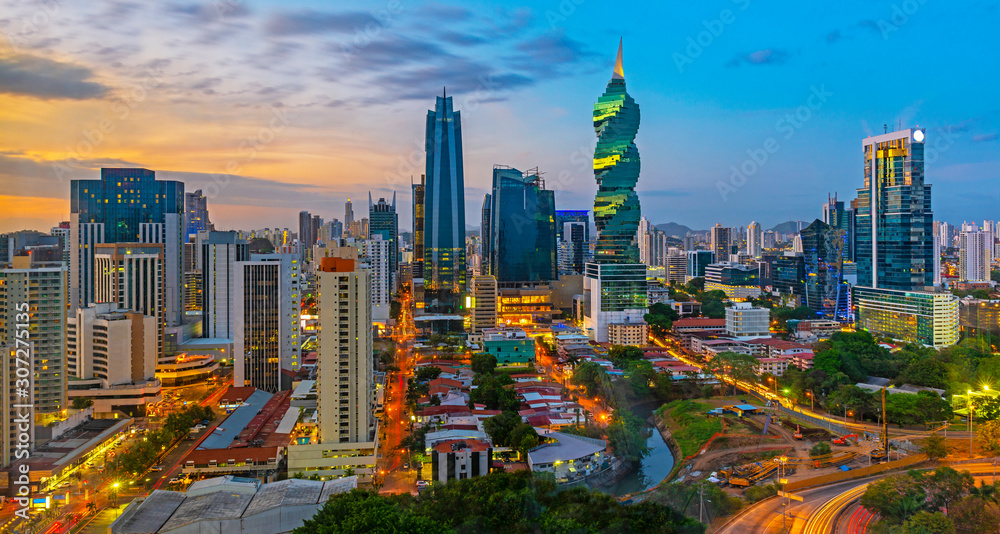 The colorful panoramic skyline of Panama City at sunset with high rise skyscrapers, Panama, Central America. - obrazy, fototapety, plakaty 