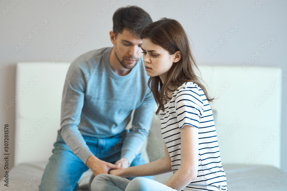 Fototapeta premium Man and woman in a bedroom