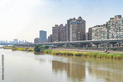 Scenery of Tamsui river bank  view on Taipei bridge  a bridge link New Taipei City to Taipei city  Taiwan