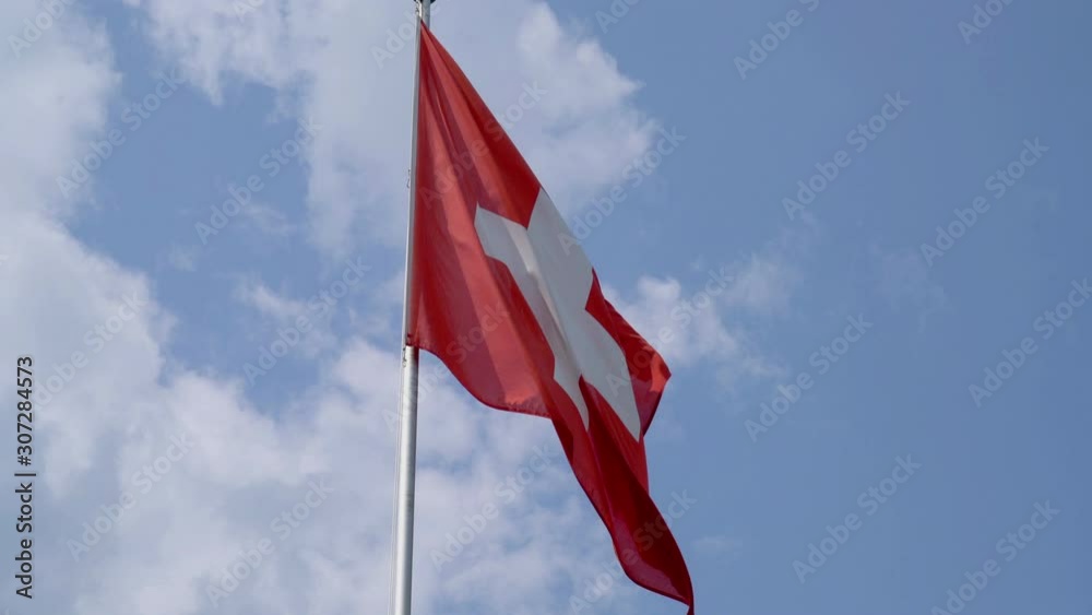 Swiss Flag with blue sky Swiss Flag with blue sky